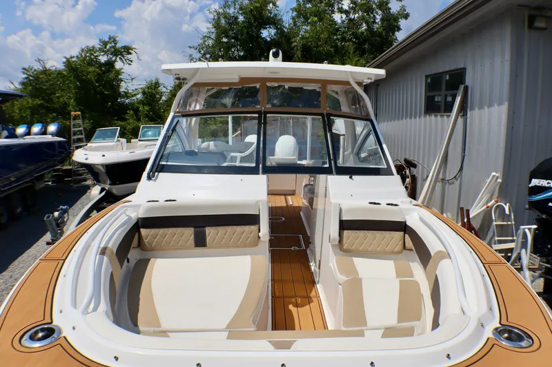 Slide: The Image of 2023 Edgewater 262CX Crossover boat with spacious seating and sleek design. - 18
