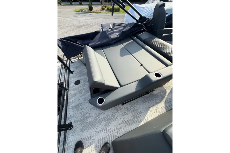 Slide: The Image of 2026 Sylvan L3 ULZ DH boat interior with gray seating and cup holders. - 25