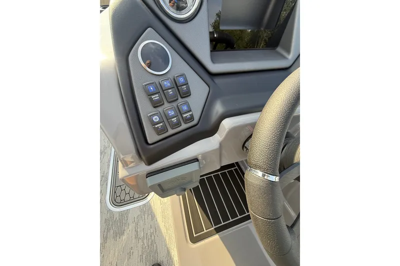 Slide: The Image of Dashboard controls of 2026 Sylvan L3 ULZ DH boat with steering wheel detail. - 14
