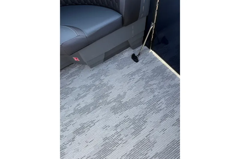 Slide: The Image of Interior of 2026 Sylvan L3 ULZ DH boat with gray seating and textured flooring. - 20