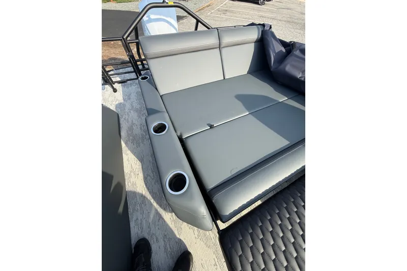 Slide: The Image of 2026 Sylvan L3 ULZ DH boat interior with gray seating and cup holders. - 27