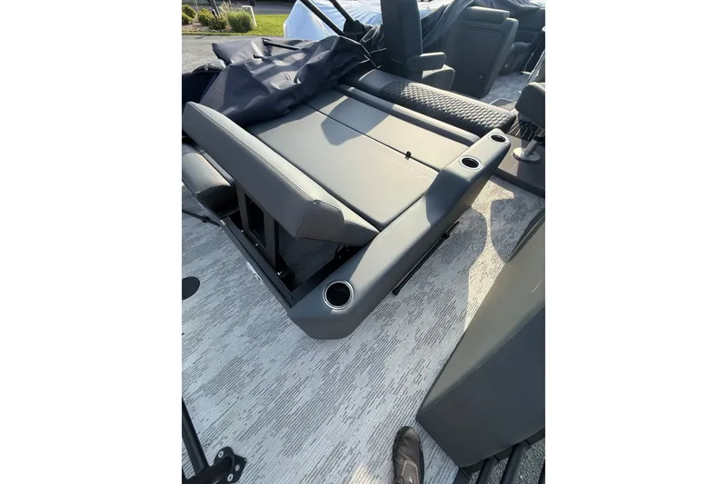 Slide: The Image of 2026 Sylvan L3 ULZ DH boat interior with gray seating and cup holders. - 26