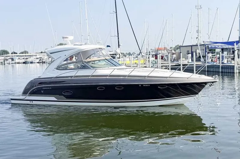 The Image of 2016 Formula 37 Performance Cruiser in marina, sleek design, calm water reflection. - 0