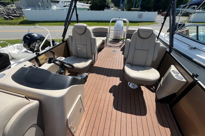Slide: The Image of 2023 Bentley Pontoons 220 Elite Admiral interior with luxurious seating and modern helm. - 10