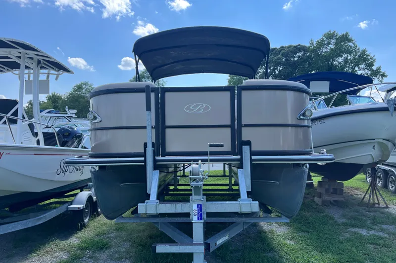 Slide: The Image of 2023 Bentley Pontoons 220 Elite Admiral on trailer under blue sky. - 20