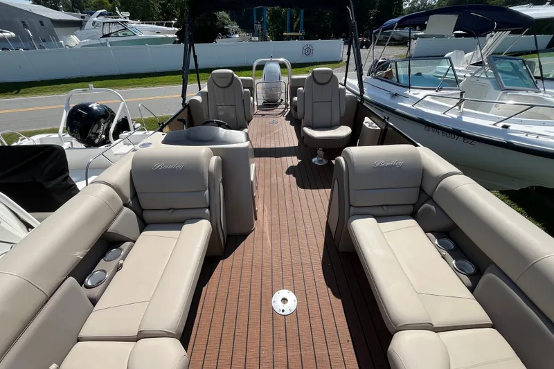 Slide: The Image of 2023 Bentley Pontoons 220 Elite Admiral with luxurious seating and sleek design. - 2