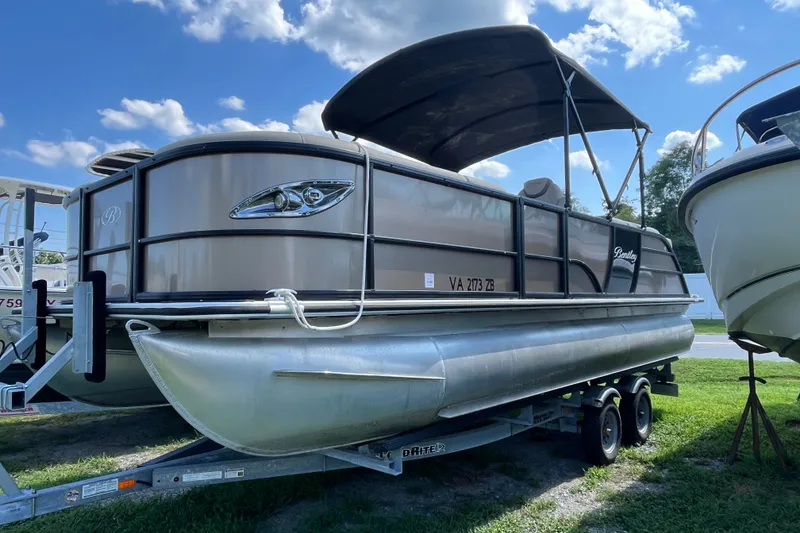 The Image of 2023 Bentley Pontoons 220 Elite Admiral on trailer under blue sky. - 0