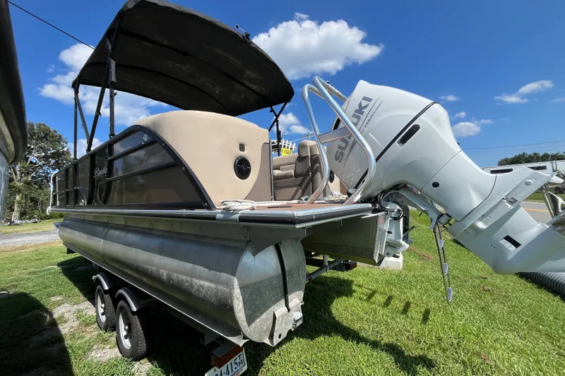 Slide: The Image of 2023 Bentley Pontoons 220 Elite Admiral with Suzuki outboard motor on trailer. - 19