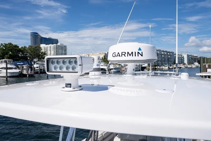 Slide: The Image of Rooftop of 2021 Intrepid 327 Nomad with Garmin radar and spotlight, docked in marina. - 40