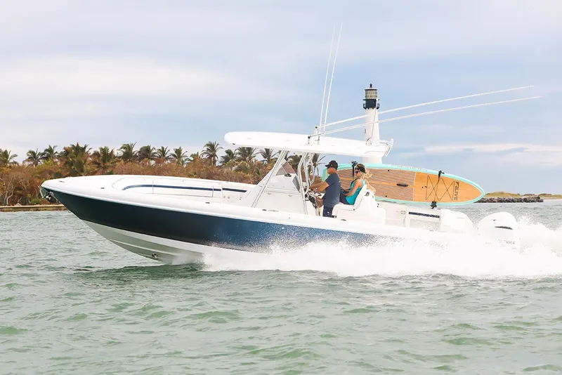 The Image of Manufacturer Provided Image: 2021 Intrepid 327 Nomad boat cruising on water with passengers. - 0