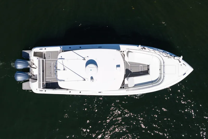 Slide: The Image of Aerial view of 2021 Intrepid 327 Nomad boat on water. - 15