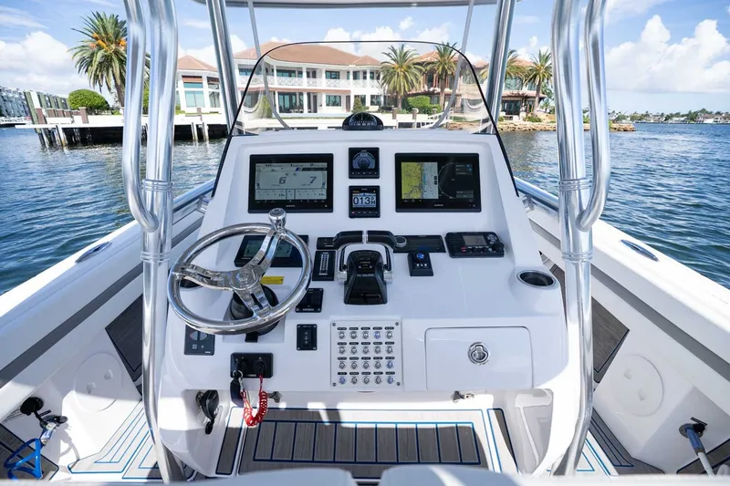 Slide: The Image of Cockpit view of 2021 Intrepid 327 Nomad boat with advanced navigation system. - 21