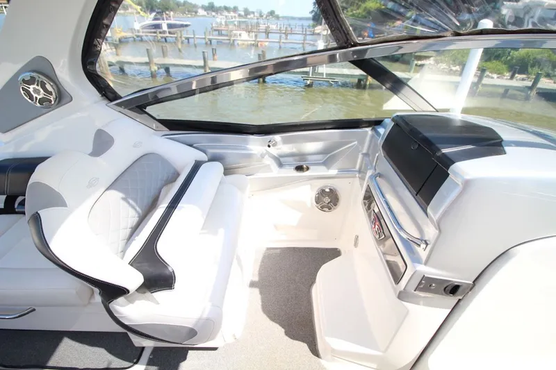 Slide: The Image of Interior of 2012 Chaparral 327 SSX boat with luxurious seating and waterfront view. - 16
