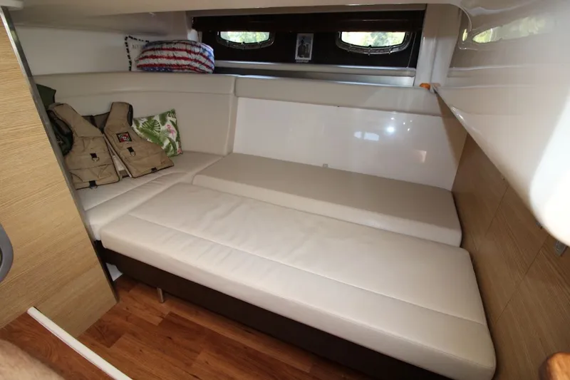Slide: The Image of Interior cabin of 2012 Chaparral 327 SSX with seating and life jackets. - 23