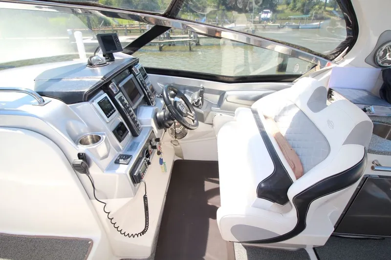 Slide: The Image of Interior cockpit of 2012 Chaparral 327 SSX boat with modern controls and seating. - 17