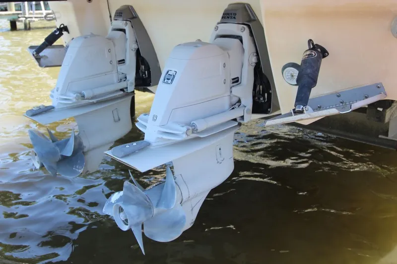Slide: The Image of Twin outboard motors on a 2012 Chaparral 327 SSX boat in water. - 30