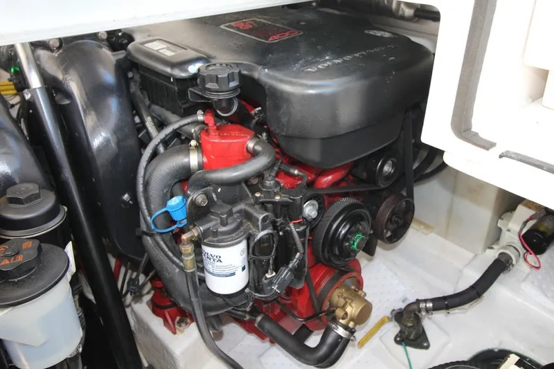 Slide: The Image of Engine compartment of a 2012 Chaparral 327 SSX boat, featuring detailed components. - 28