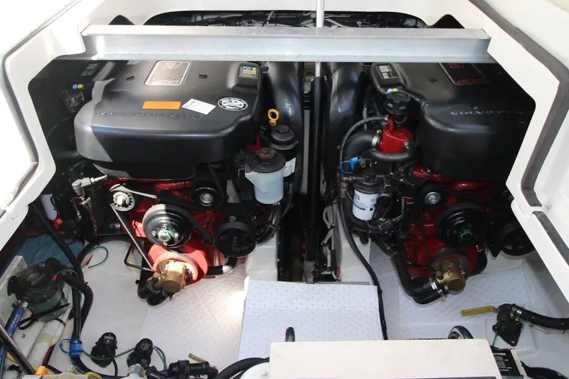 Slide: The Image of Engine compartment of a 2012 Chaparral 327 SSX boat, featuring dual Volvo Penta engines. - 26