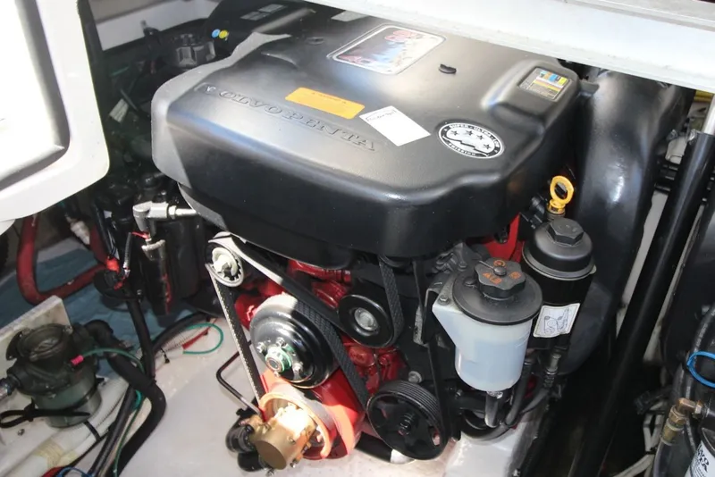 Slide: The Image of Engine compartment of a 2012 Chaparral 327 SSX boat featuring a Volvo Penta engine. - 27