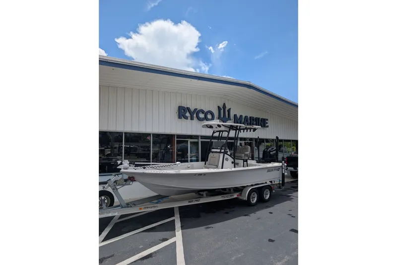 The Image of 2023 Sea Pro 228 Bay boat on trailer outside Ryco Marine dealership. - 1