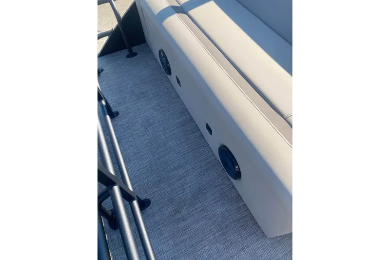 Slide: The Image of 2026 Bentley Pontoons Legacy 243 Swingback interior seating and flooring detail. - 14