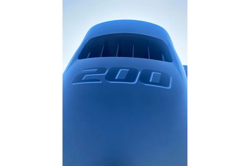 Slide: The Image of Close-up of a 2026 Bentley Pontoons Legacy 243 Swingback engine with "200" marking. - 13