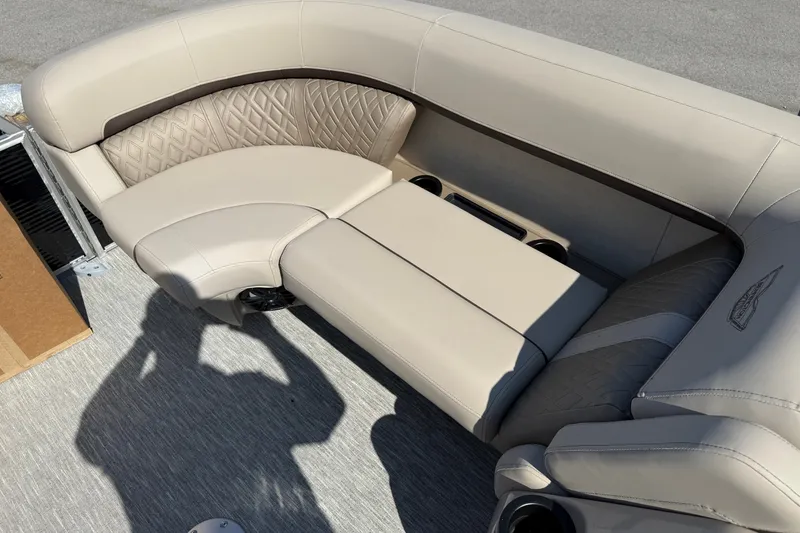 Slide: The Image of Luxurious seating on a 2027 Bennington 23 MSL boat, featuring beige upholstery and cup holders. - 6