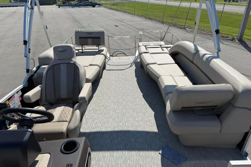 Slide: The Image of 2027 Bennington 23 MSL pontoon boat interior with luxurious seating and helm. - 11