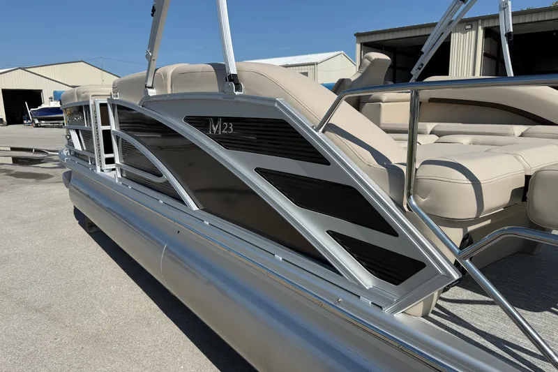Slide: The Image of 2027 Bennington 23 MSL pontoon boat with sleek design and comfortable seating. - 3