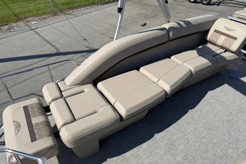 Slide: The Image of 2027 Bennington 23 MSL boat with luxurious beige seating and elegant design. - 5