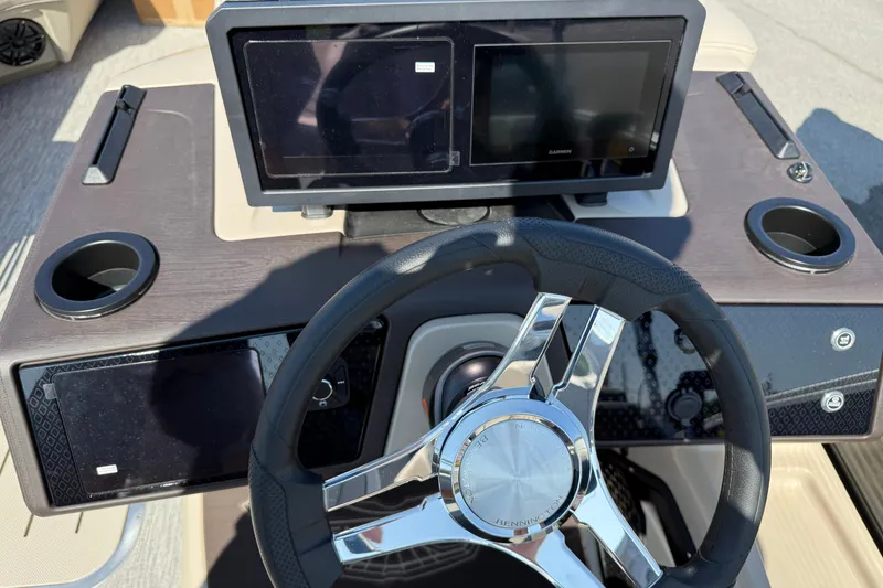 Slide: The Image of Steering console of 2027 Bennington 23 MSL boat with modern controls and cup holders. - 8