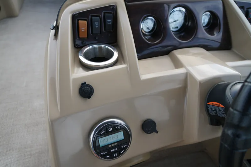 Slide: The Image of Dashboard of a 2018 Bennington 22 SSX boat with controls and gauges. - 19