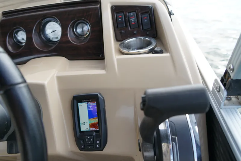 Slide: The Image of Dashboard of a 2018 Bennington 22 SSX boat with Garmin navigation system. - 18