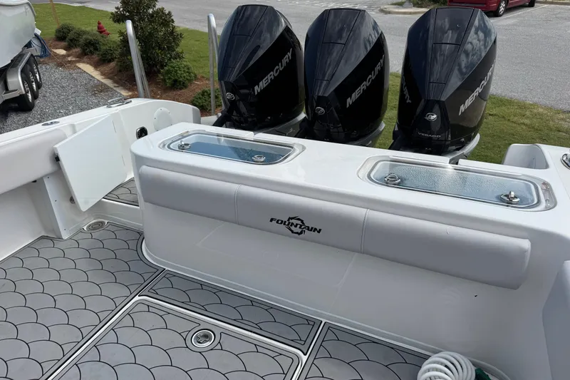 Slide: The Image of 2024 Fountain 34 Tournament Edition boat with triple Mercury engines, featuring a sleek deck design. - 25
