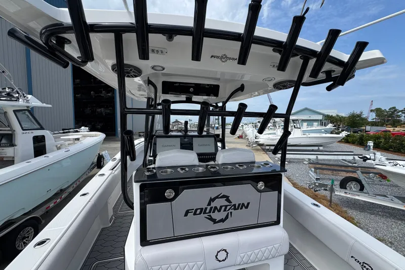 Slide: The Image of 2024 Fountain 34 Tournament Edition boat with rod holders and Garmin electronics. - 21