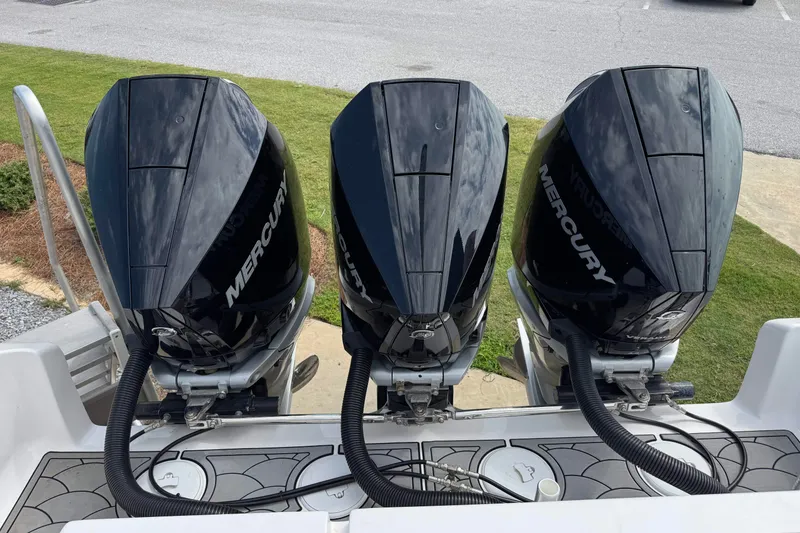 Slide: The Image of Triple Mercury outboard engines on a 2024 Fountain 34 Tournament Edition boat. - 26