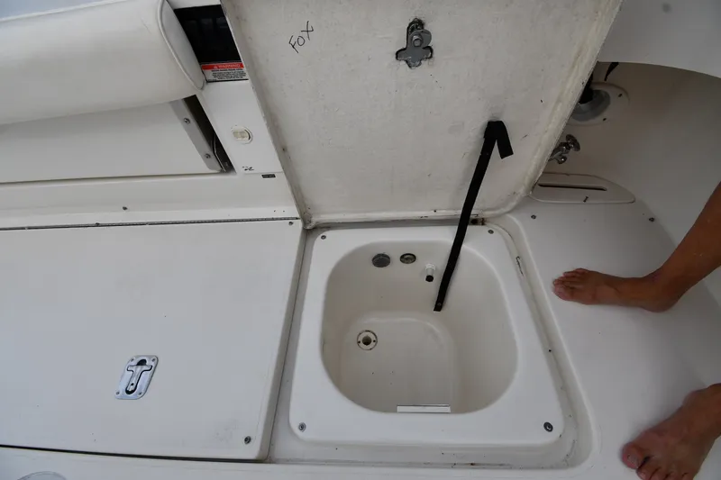 Slide: The Image of Open storage compartment on a 2000 Sea Ray 330 Express Cruiser boat deck. - 40