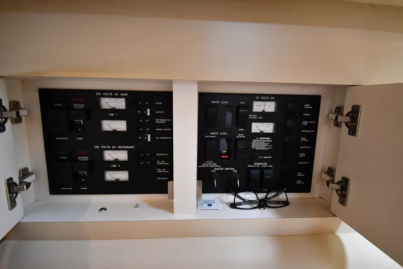 Slide: The Image of Electrical control panel inside a 2000 Sea Ray 330 Express Cruiser boat. - 32
