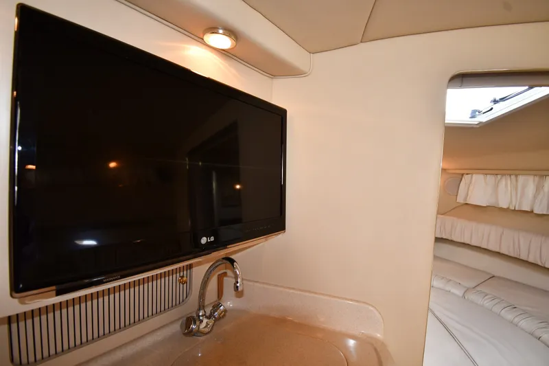 Slide: The Image of Interior of 2000 Sea Ray 330 Express Cruiser with TV and sink. - 30