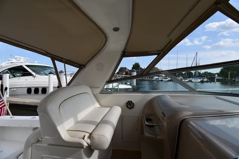 Slide: The Image of Interior view of a 2000 Sea Ray 330 Express Cruiser at a marina. - 14
