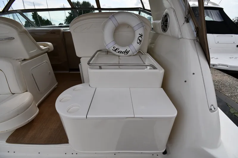 Slide: The Image of Interior of 2000 Sea Ray 330 Express Cruiser with seating and life preserver. - 17