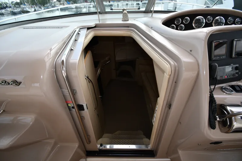 Slide: The Image of 2000 Sea Ray 330 Express Cruiser cabin entrance with helm and control panel. - 18
