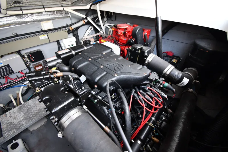 Slide: The Image of Engine room of a 2000 Sea Ray 330 Express Cruiser, showcasing detailed mechanical components. - 36