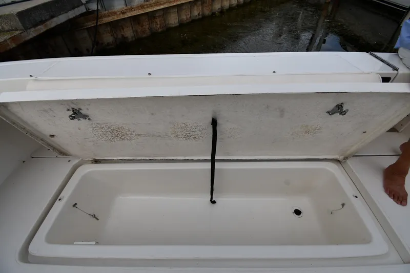 Slide: The Image of Open storage compartment on a 2000 Sea Ray 330 Express Cruiser boat. - 39