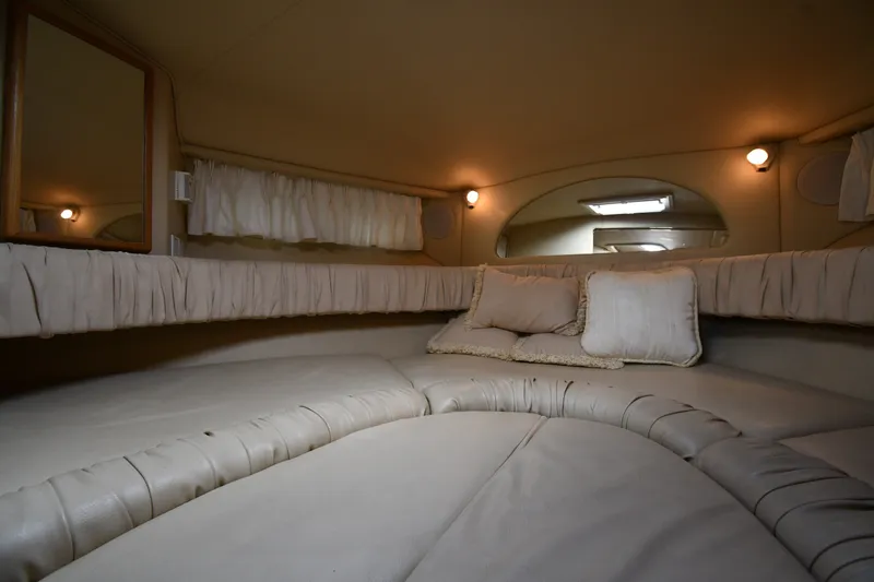 Slide: The Image of Interior cabin of 2000 Sea Ray 330 Express Cruiser with plush seating and ambient lighting. - 25