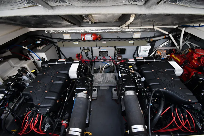 Slide: The Image of Engine room of a 2000 Sea Ray 330 Express Cruiser with dual engines and equipment. - 35