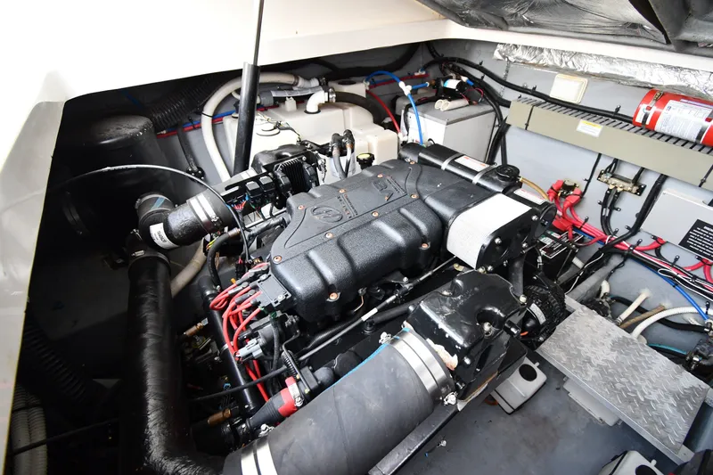 Slide: The Image of Engine room of a 2000 Sea Ray 330 Express Cruiser, showcasing detailed components. - 37