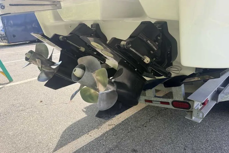 Slide: The Image of 2018 Formula 290 Sun Sport boat propellers on trailer, showcasing dual outboard motors. - 6