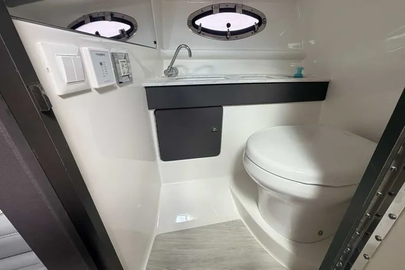 Slide: The Image of 2018 Formula 290 Sun Sport boat bathroom with sink and toilet. - 44