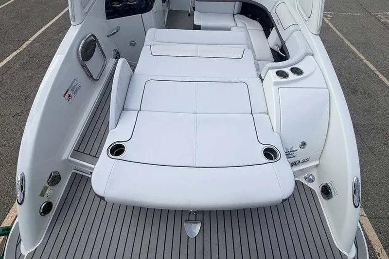 Slide: The Image of 2018 Formula 290 Sun Sport boat with spacious white seating and cup holders. - 10